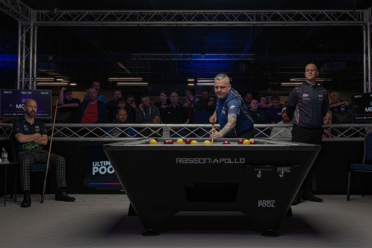 A professional snooker match scene with players and officials around a polished snooker table in an indoor arena. The table is branded 'RASSON APOLLO' and 'ULTIMATE POOL'.